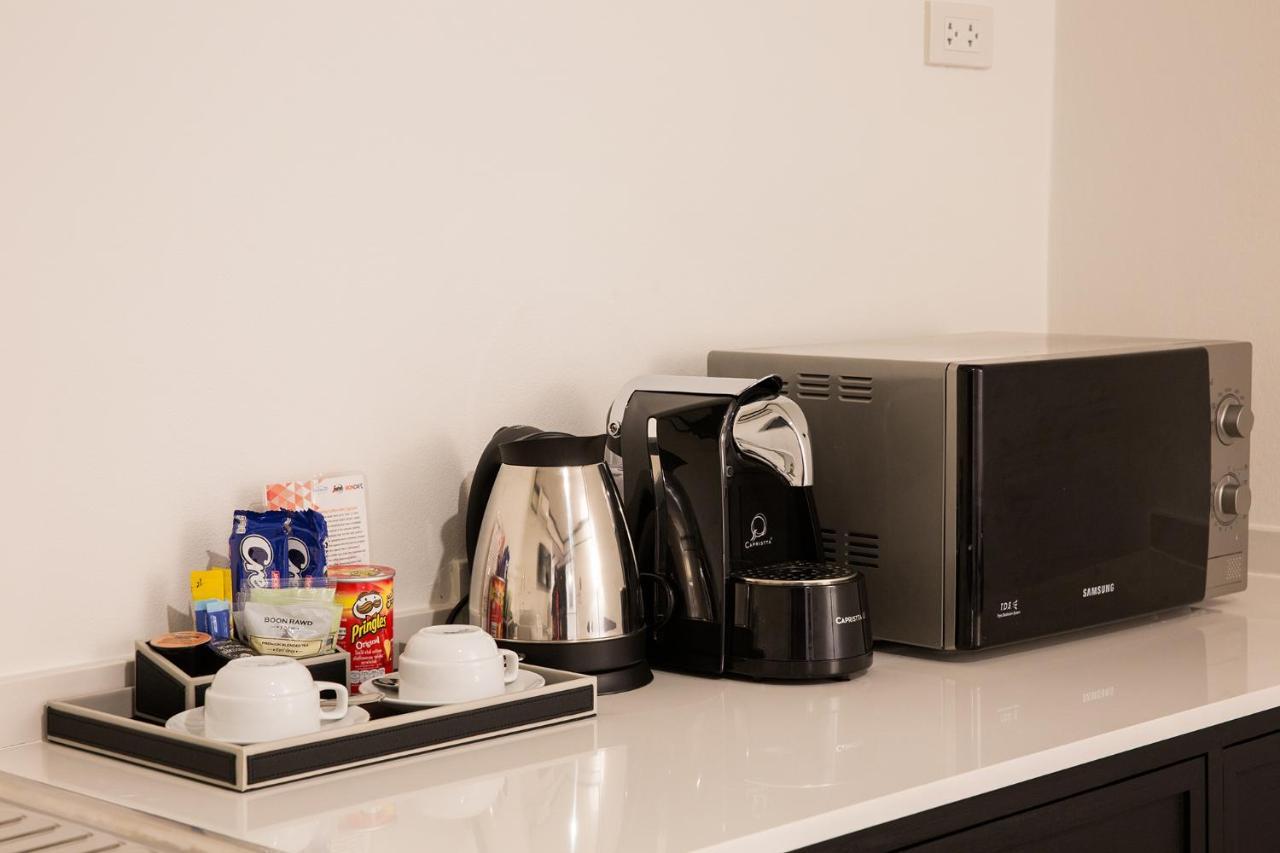 Mora Boutique Hotel - Sha Extra Plus Čiang Rai Exteriér fotografie A Nespresso machine in a hotel room